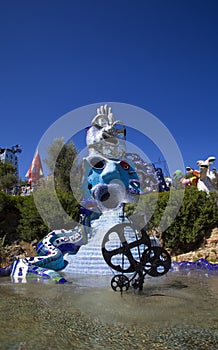 Colorful and vibrant monumental sculptures representing Tarot cards in a Mediterranean garden photo