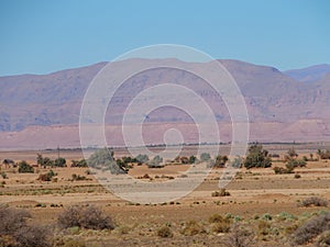 Colorful view of sandy desert at high ATLAS MOUNTAINS range landscape in MOROCCO