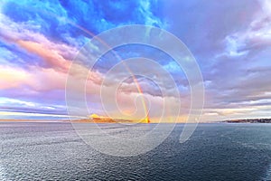 Colorful views of the rainbow against the sky, clouds and sea horizon. Commencement Bay,Tacoma,USA