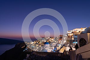 Colorful village of Oia on the island of Santorini, Greece after sunset