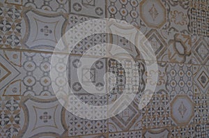 Colorful vintage ceramic tiles wall decoration. Turkish ceramic tiles wall background in light brown colors