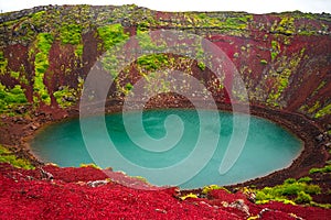 Colorful volcanic crater filled with blue water, Iceland