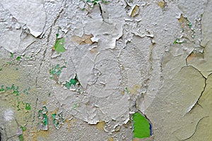 Colorful wall background with damaged paints of gray silver and green