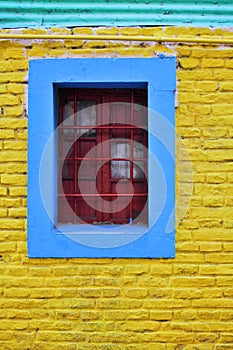 Colorful wall and grilled window