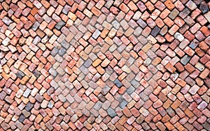 Colorful wall of loosely piled bricks