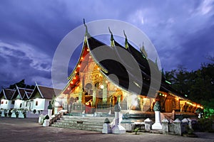 Colorful Wat Xieng thong temple at dusk in Luang Prabang, Loas