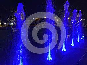 Colorful Water Fountain Blue Lights at Night