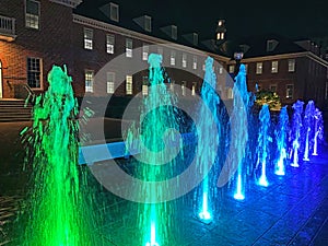 Colorful Water Jets and Old Fannie Mae Building at Night in Washington DC