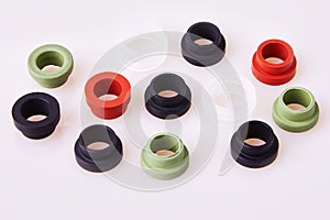 Colorful water level rubber gaskets scattered on the table.