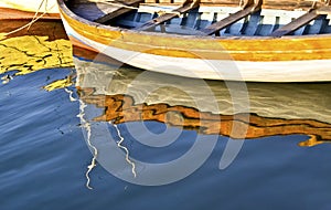 Colorful water reflections of a fishing boat - Aegean sea Greece