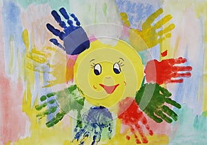 Colorful watercolor children handprints around the sun