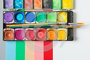 Colorful of Watercolor palette and paintbrush  on colorful background