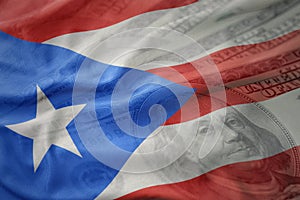 Colorful waving national flag of puerto rico on a american dollar money background.