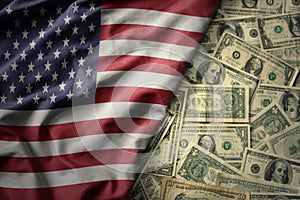 colorful waving national flag of united states of america on a american dollar money background. finance concept