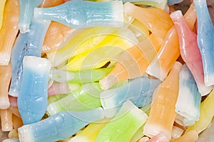 Colorful wax bottles candy treats filled with sweet drink