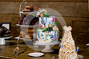 Colorful Wedding Cake at Indoor Reception