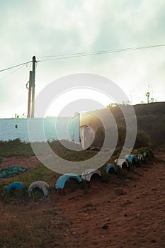 Colorful wheels decoration captured from the bottom of the mountain with a sunrise on the background