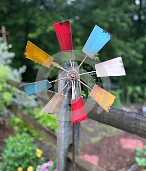 Colorful wind spinner in a garden