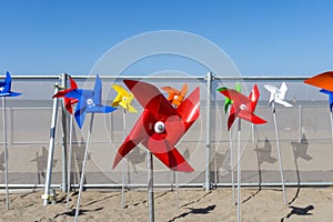 Colorful windmill toy standing on Iho Tewoo Beach, Jeju, South Korea