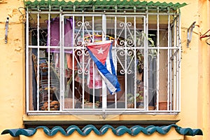 Colorful window with a Cuban flag in Old Havana Cuba