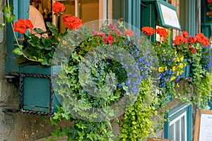 Colorful windowbox at open air bistro photo