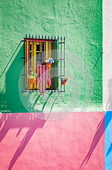 Colorful windows and shutters and walls of buildings in La Boca