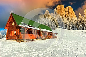 Colorful winter sunset and shelter,Carpathians,Transylvania,Romania,Europe