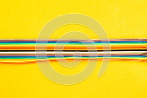 Colorful wires isolated on yellow background. connection wire for electrical schemes. copy space