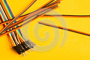 Colorful wires isolated on yellow background. connection wire for electrical schemes. copy space