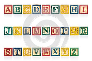 Colorful wood alphabet blocks isolated on white