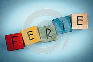 Colorful wooden blocks for children with the words `Ferie` in Polish, which means a winter break in school for schools in Poland photo