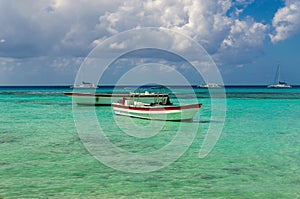 Colorful wooden boats on azur beautiful Caribbean, Dominican Republic