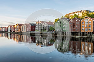 Colorful wooden buildings near Nidelva river in the city of Bakklandet/Trondheim in Norway.