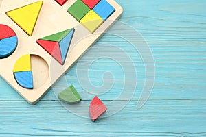 Colorful wooden cubes on blue wooden background. Top view. Toys in the table