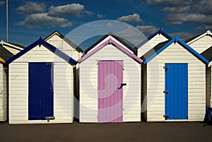 Colorful wooden houses, cabins on the English beach.