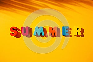 Colorful wooden letters phrase SUMMER.