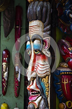 Colorful wooden masks and handicrafts on sale at shop in the Thamel District of Kathmandu, Nepal.