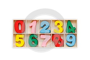 Colorful wooden number in square box. Top view. Isolated on whit