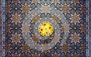 Colorful wooden ornate ceiling with floral and geometrical patterns at historic Manial Palace of Prince Mohammed Ali, Cairo, Egypt