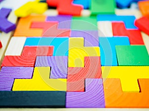 Colorful wooden puzzle on white background