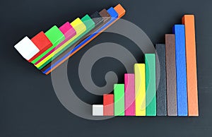 Colorful wooden rectangles for math Cuisenaire rods on black background.