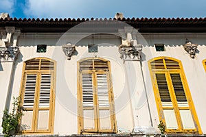 Colorful wooden window Colonial style architectu re building home and living in Little India, Singapore photo