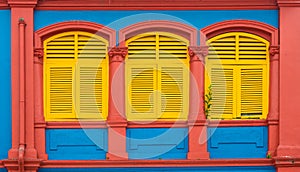 Colorful wooden window Colonial style architectu re building home and living in Little India, Singapore photo