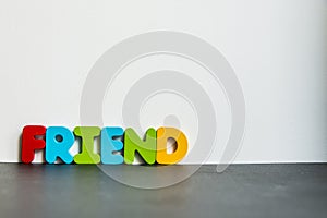 Colorful wooden word Friend with white background1