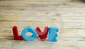 Colorful wooden word Love on woodne floor7