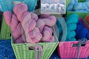 Colorful wool in rectangular baskets