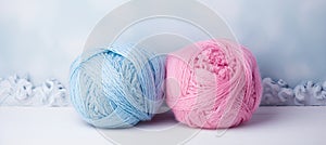 Colorful wool yarn balls on gray background with copy space for text or advertising concept.