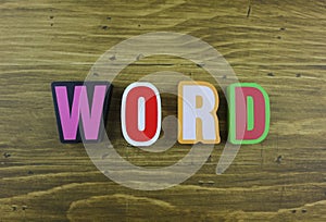 The colorful word `Word` over the wooden board surface.