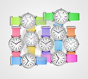 Colorful wrist watches on gray background