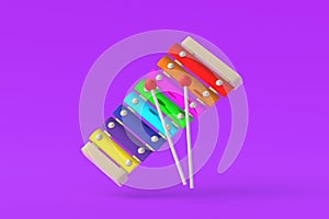 Colorful xylophone with sticks on violet background. Kids toy. Preschool education